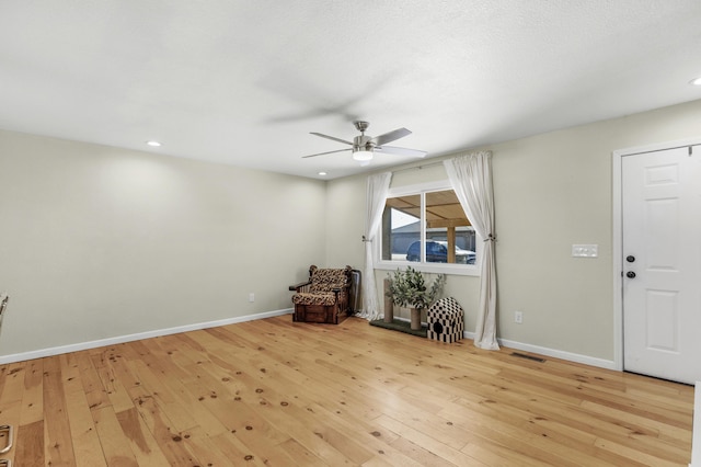 foyer featuring light hardwood / wood-style flooring and ceiling fan