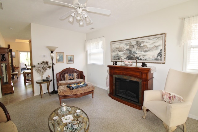 living room with light carpet and ceiling fan