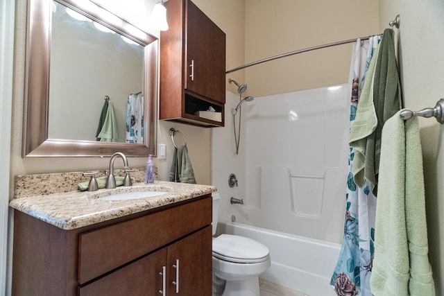 full bathroom featuring toilet, vanity, and shower / bath combo with shower curtain