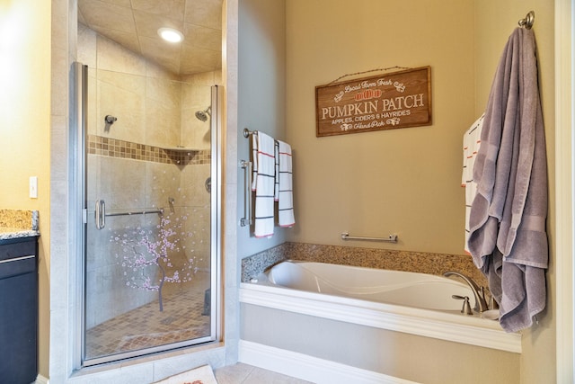 bathroom featuring tile patterned floors, separate shower and tub, and vanity