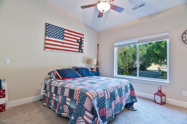 carpeted bedroom with ceiling fan and lofted ceiling