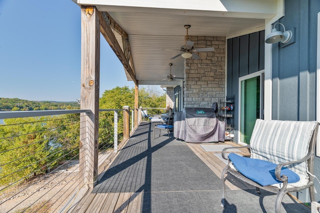 exterior space with a balcony and ceiling fan