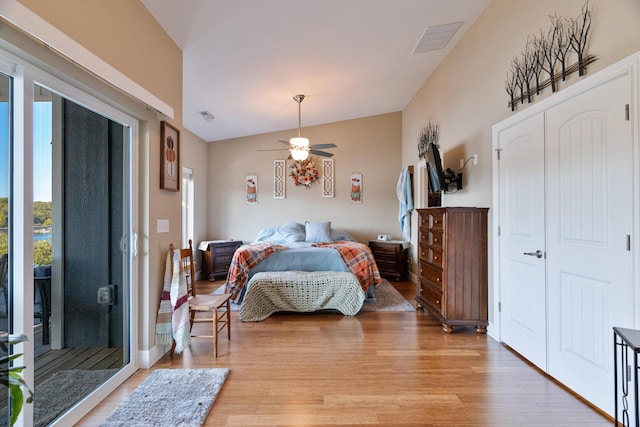 bedroom with lofted ceiling, access to exterior, ceiling fan, and light wood-type flooring