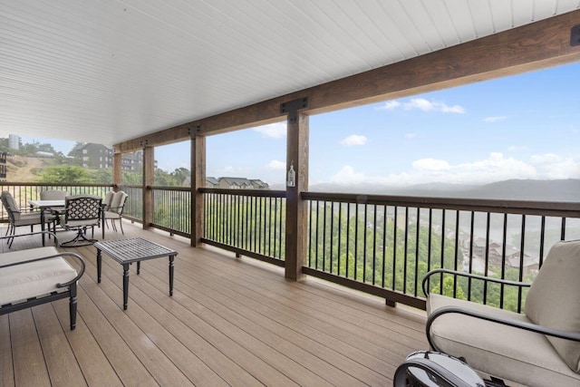 wooden terrace featuring outdoor dining space