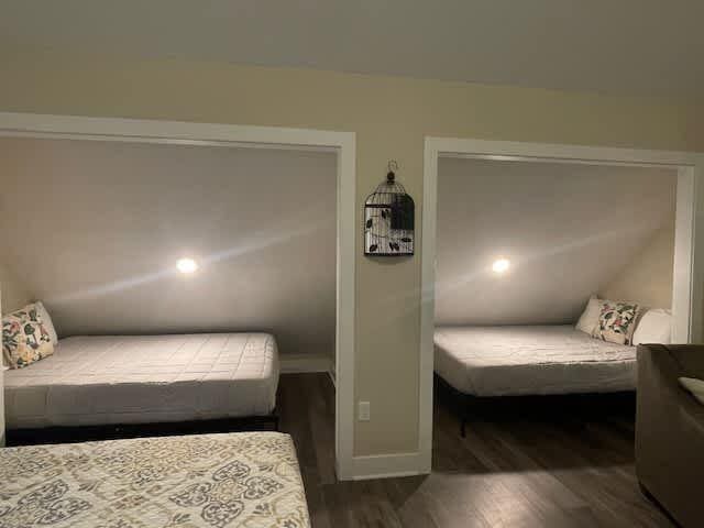 bedroom featuring wood finished floors and baseboards