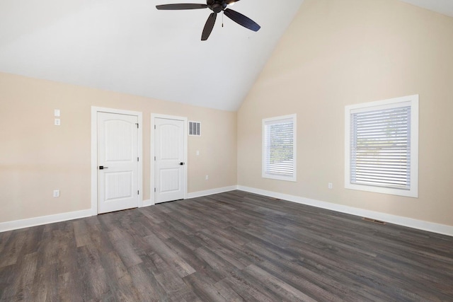 spare room featuring dark wood finished floors, visible vents, and baseboards