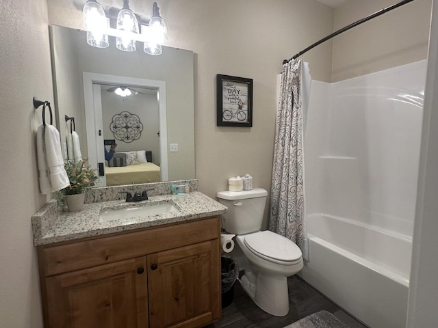 full bath with vanity, ensuite bath, toilet, and shower / tub combo with curtain