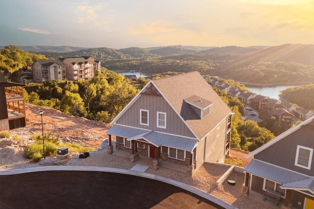 bird's eye view featuring a water and mountain view