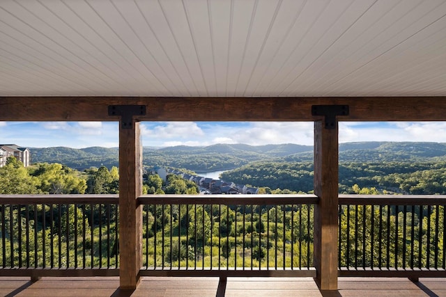 wooden deck with a mountain view