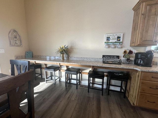 dining space featuring dark wood finished floors