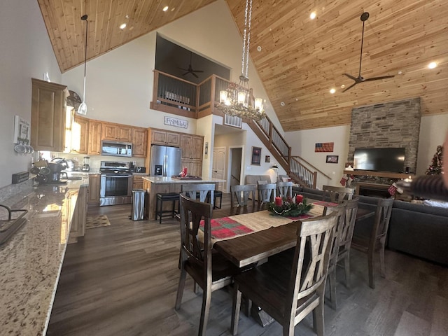 dining room featuring ceiling fan with notable chandelier, recessed lighting, stairway, wood ceiling, and dark wood-style flooring