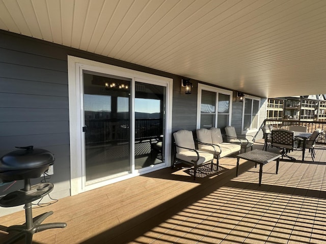 wooden deck featuring grilling area