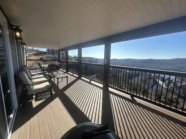 wooden deck with a mountain view