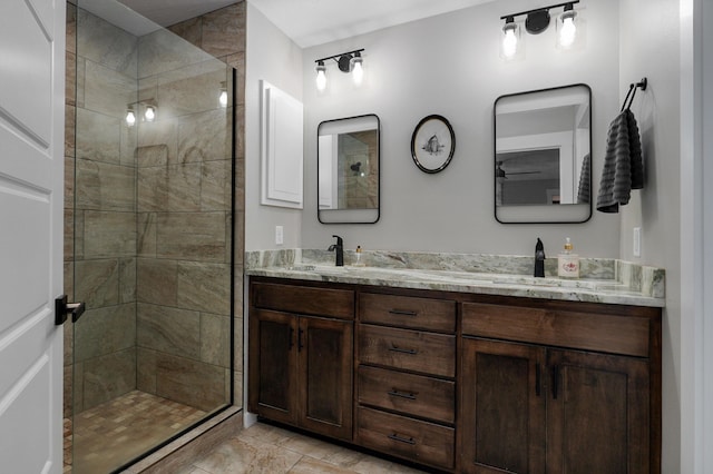 bathroom with vanity and tiled shower