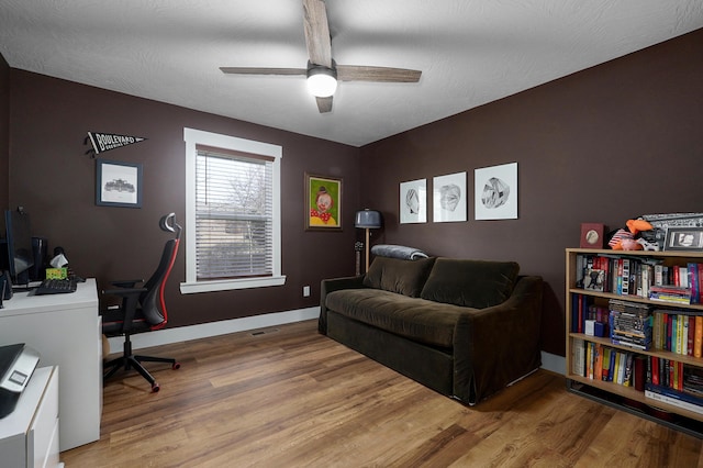 office space featuring ceiling fan and hardwood / wood-style floors