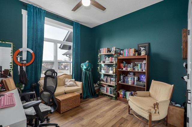 office area with hardwood / wood-style flooring and ceiling fan