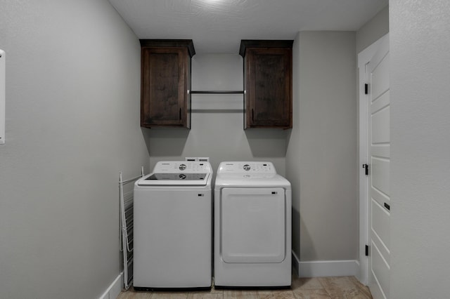 laundry area with cabinets and washer and dryer