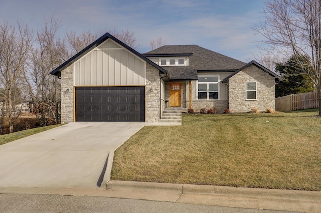 view of front of home with a garage and a front lawn