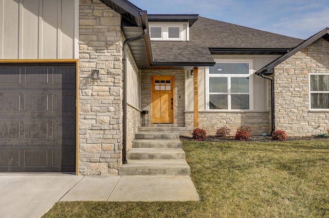 entrance to property featuring a yard