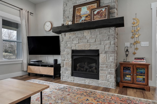 living room featuring hardwood / wood-style floors and a fireplace