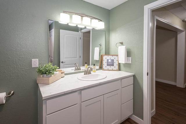 bathroom with vanity and hardwood / wood-style flooring