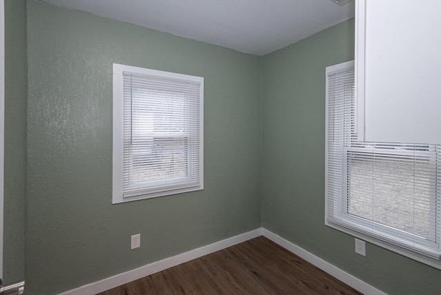 empty room featuring dark hardwood / wood-style floors