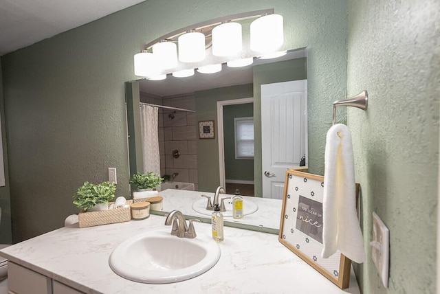 bathroom featuring vanity and shower / bath combination with curtain