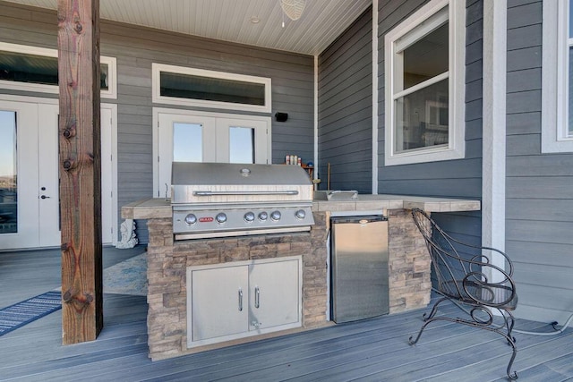 wooden deck featuring area for grilling and grilling area