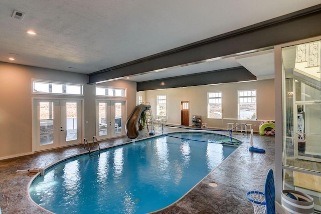 view of pool with french doors