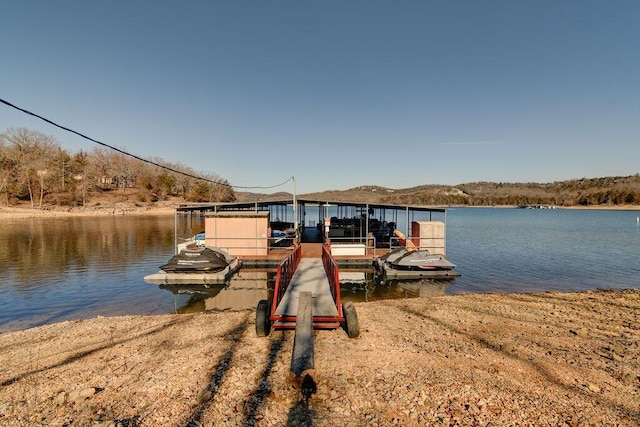 view of dock with a water view