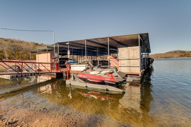 view of dock with a water view