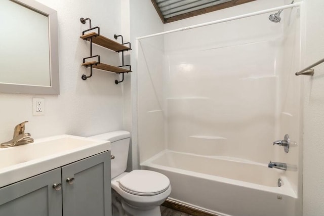 full bathroom featuring vanity, tub / shower combination, and toilet