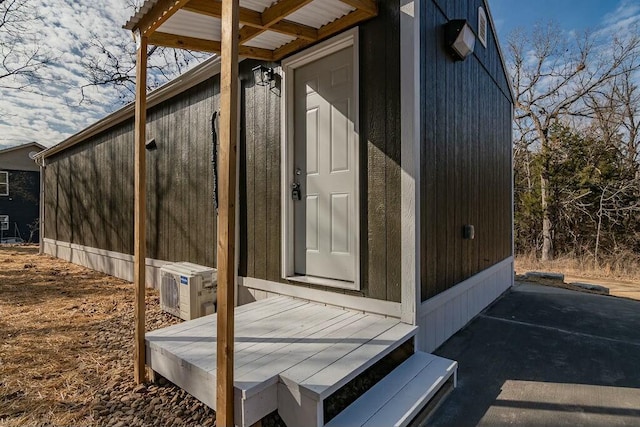 view of side of property featuring a wooden deck