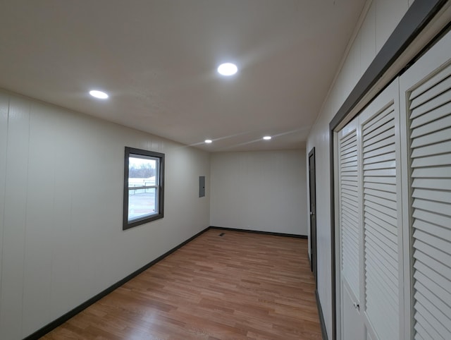 unfurnished bedroom with light hardwood / wood-style floors and a closet