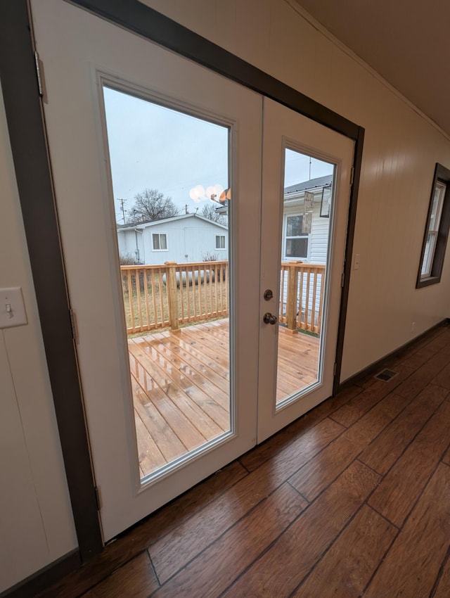 doorway to outside featuring dark wood-type flooring and french doors