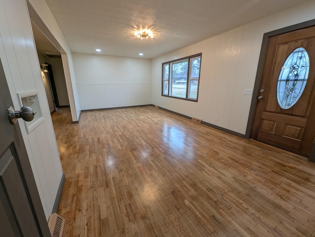 foyer entrance with wood-type flooring