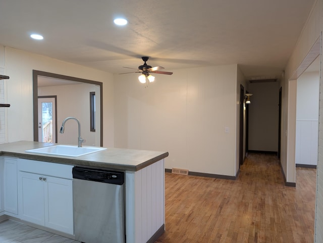 kitchen featuring sink, light wood-type flooring, dishwasher, ceiling fan, and white cabinets