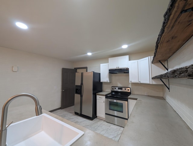 kitchen with white cabinetry, sink, and stainless steel appliances