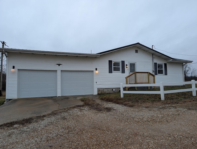 ranch-style house featuring a garage