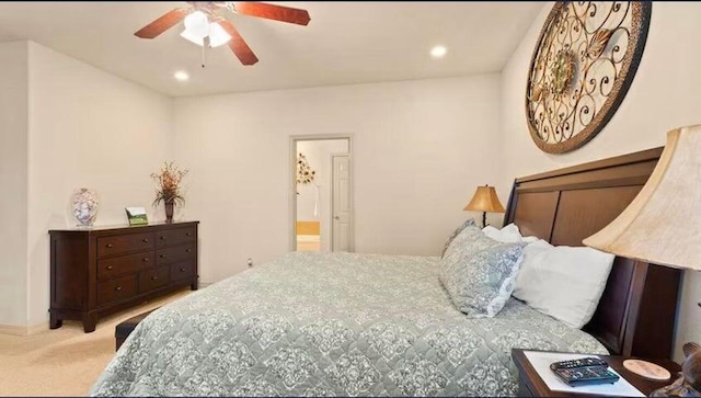 carpeted bedroom featuring ceiling fan