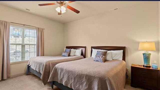 bedroom with light carpet and ceiling fan