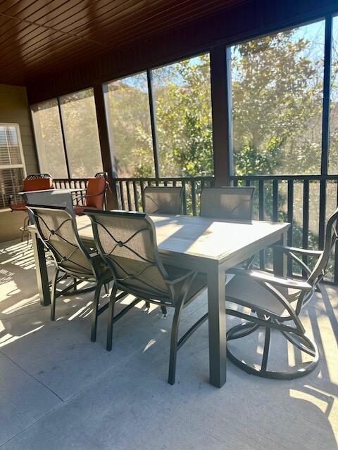 sunroom featuring wood ceiling