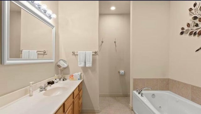 bathroom featuring vanity, a bathing tub, and tile patterned floors