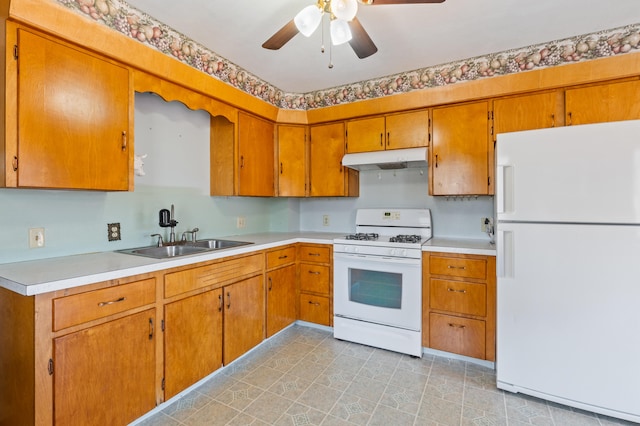 kitchen with ceiling fan, white appliances, and sink