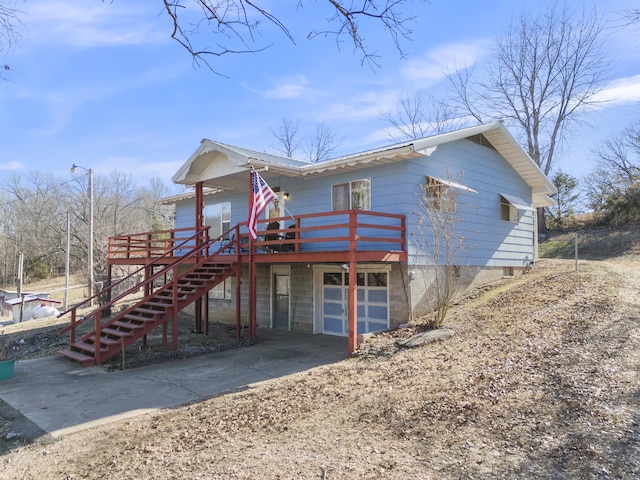 view of front facade featuring a garage and a deck