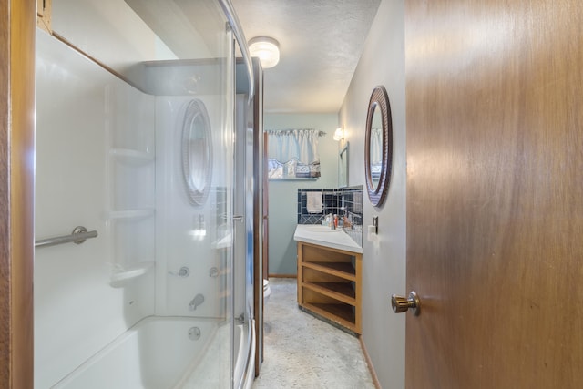 bathroom with vanity and shower / bath combination with glass door