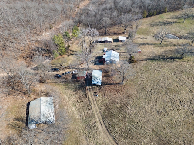 birds eye view of property with a rural view