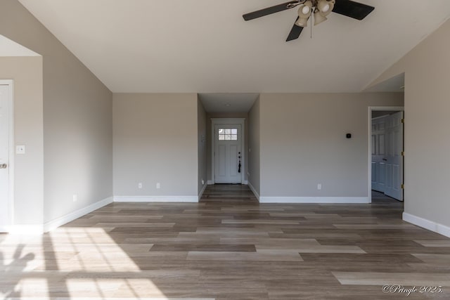 unfurnished living room with lofted ceiling, ceiling fan, and light wood-type flooring