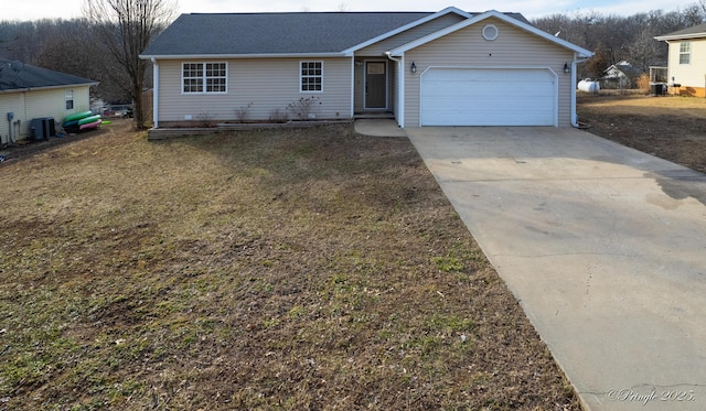 ranch-style house with a garage and central air condition unit