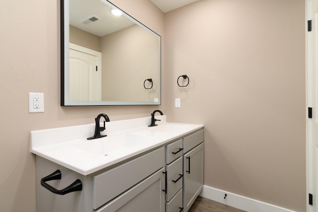 bathroom featuring vanity and hardwood / wood-style floors